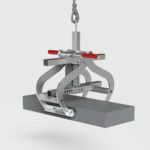 kerb lifter lifting a kerb stone side view
