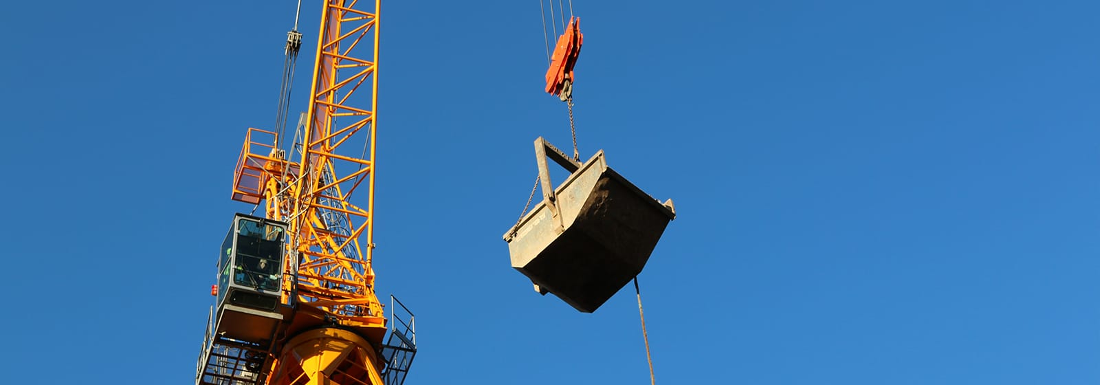Conquip boat skip being crane lifted