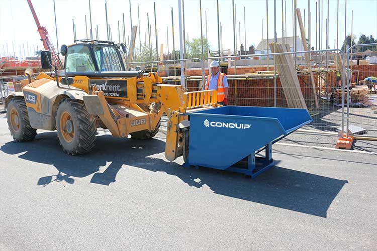 autolock self tipping skip used with telehander on a building site