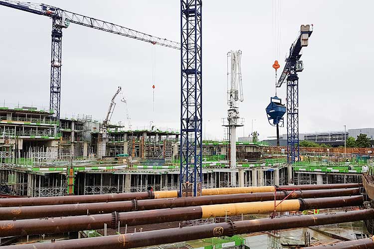 cocrete column skip crane lifted on site