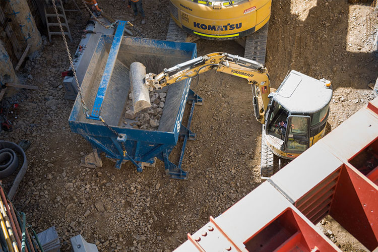 direct-to-truck bulkx being loaded by an excavator during Melbourne Metro Town Hall Station excavation