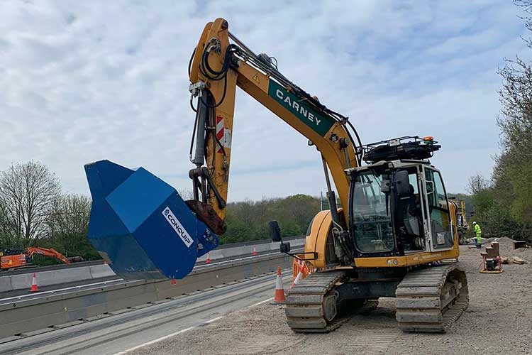 Conquip Excavator Pouring Bucket on an excavator in action for Carney on civils project