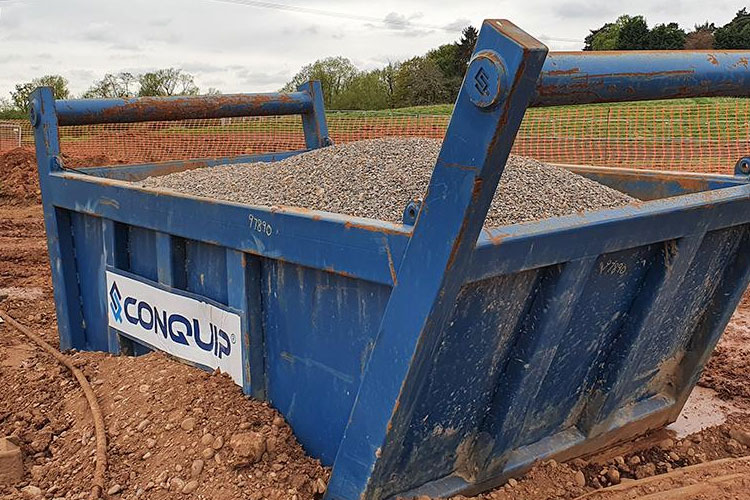 Excavator Drag Skip on-site filled with pea shingle