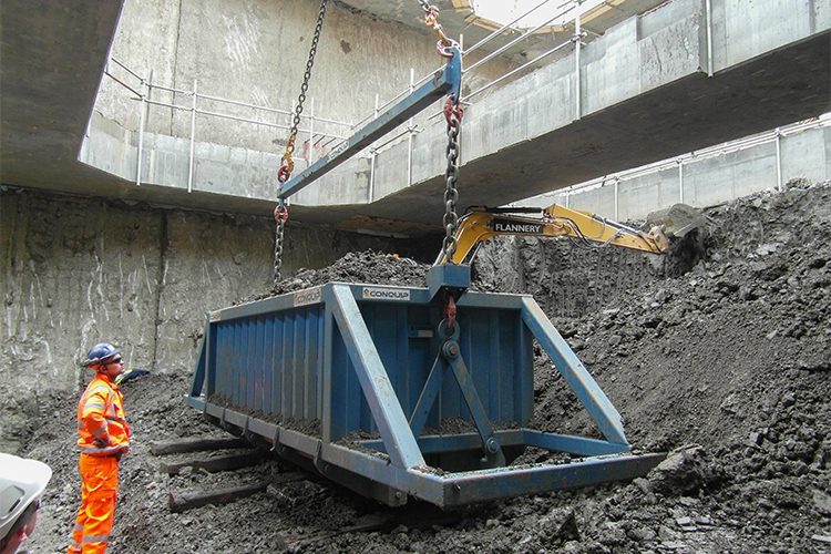 BulkX skip being loaded with spoil from tunnelling excavation by excavator