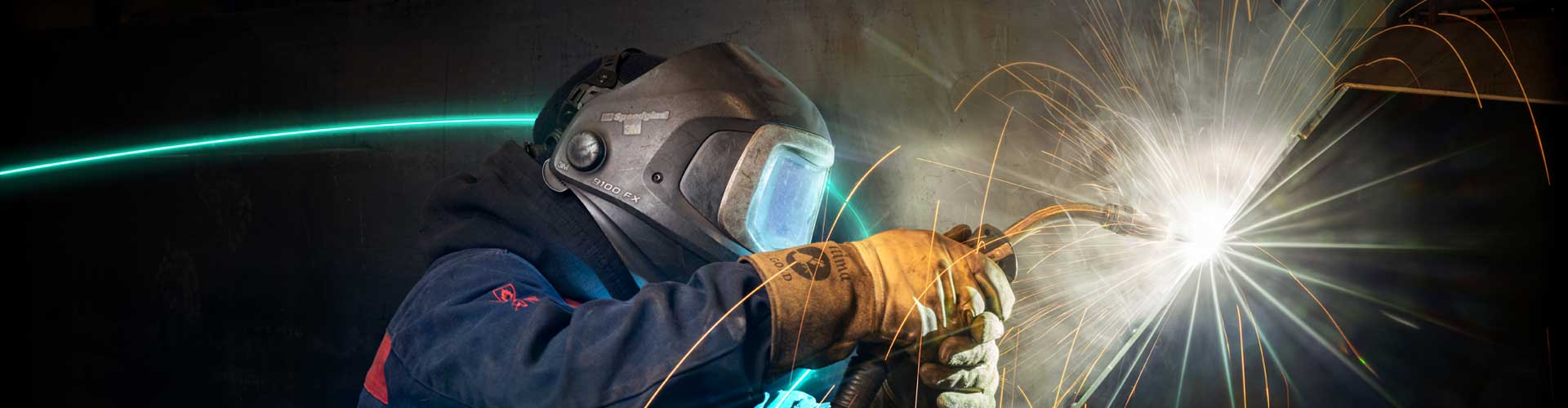 A man welding a Conquip skip