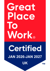 A badge with a red and blue background reads: Great Place To Work Certified JAN 2025–JAN 2026 UK.