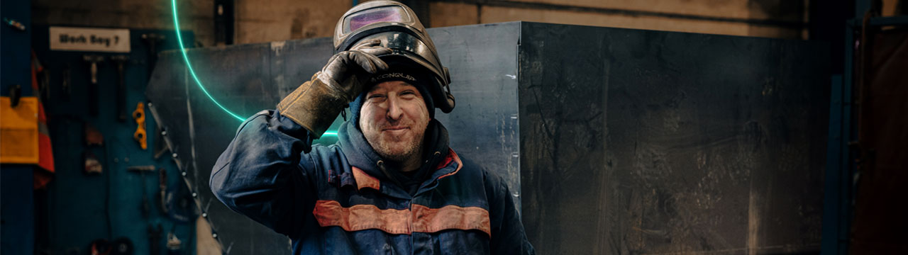 A man with a welding mask.