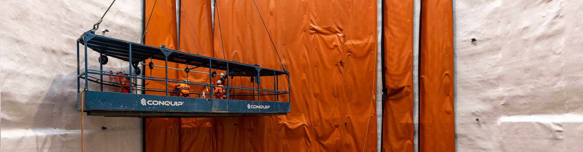 Men on a Conquip Shaft Access Platform lowering into a shaft.