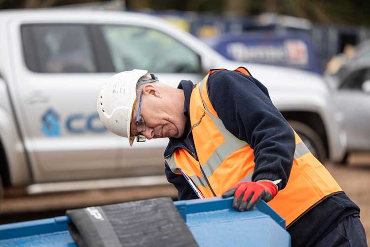 Man inspecting equipment on a construction site