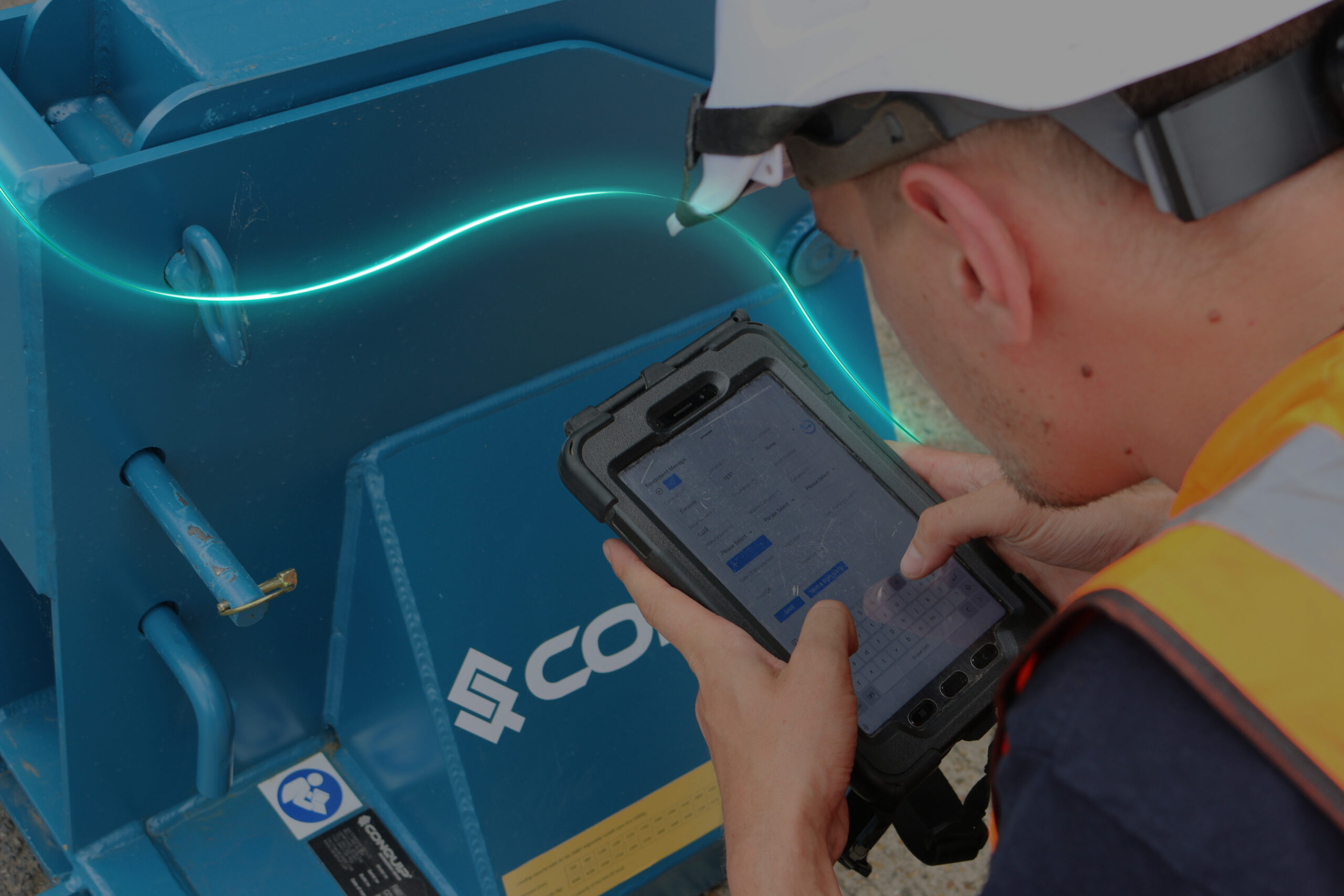 A Conquip engineer recording a customer's job on a tablet