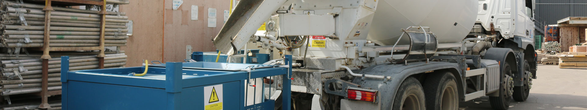 Concrete truck washing out into Conquip Compact Concrete Washout Unit, banner image, product resource web page