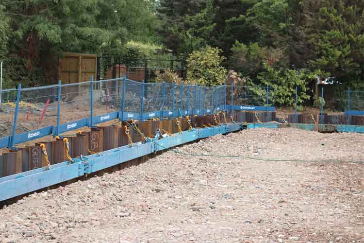 Excavation filled out with pile sheets around and edge protection around