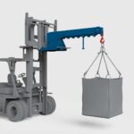 conquip forklift crane arm on a forklift lifting a load