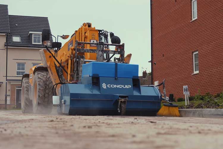 conquip forklift road sweeper attachment in use on a constructionsite